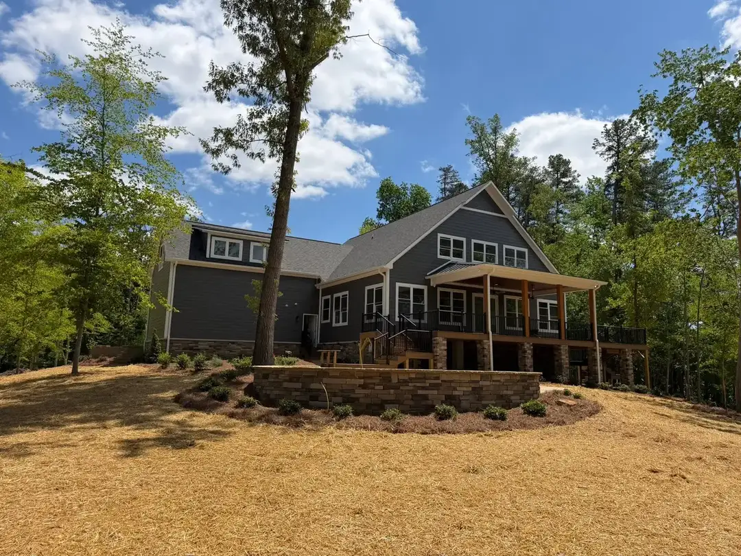 Boulder retaining wall in a finished lake landscape