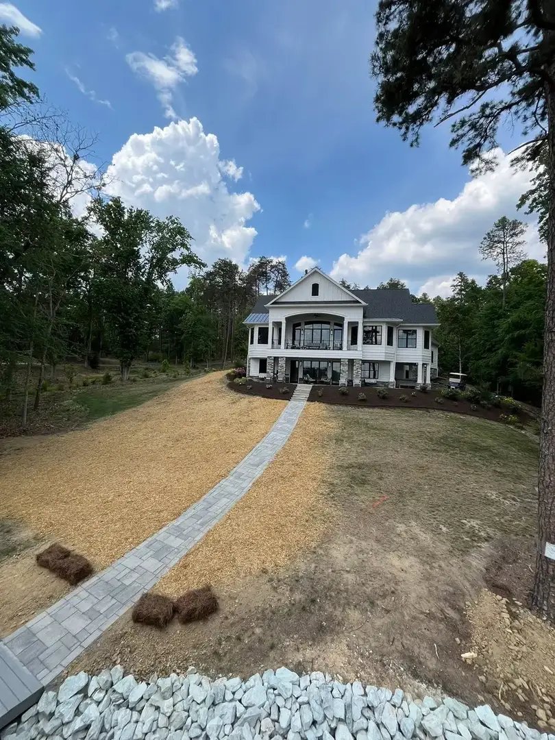 Stone walkway leading down to a lakeside dock