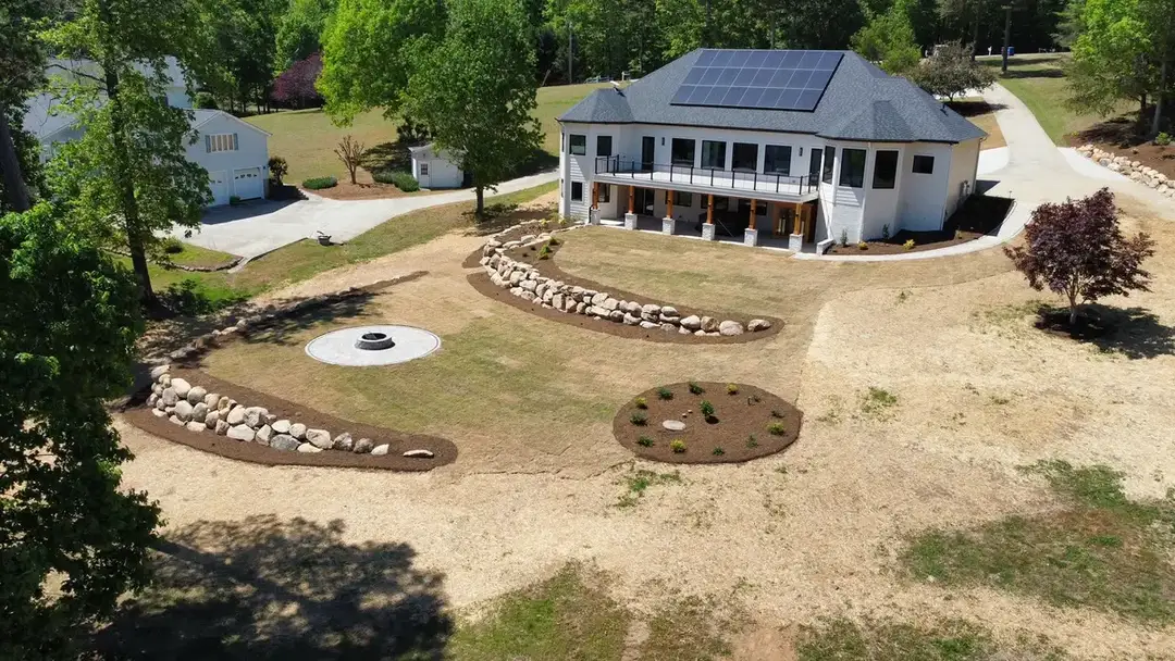 Boulder walls and walkways in a finished landscape