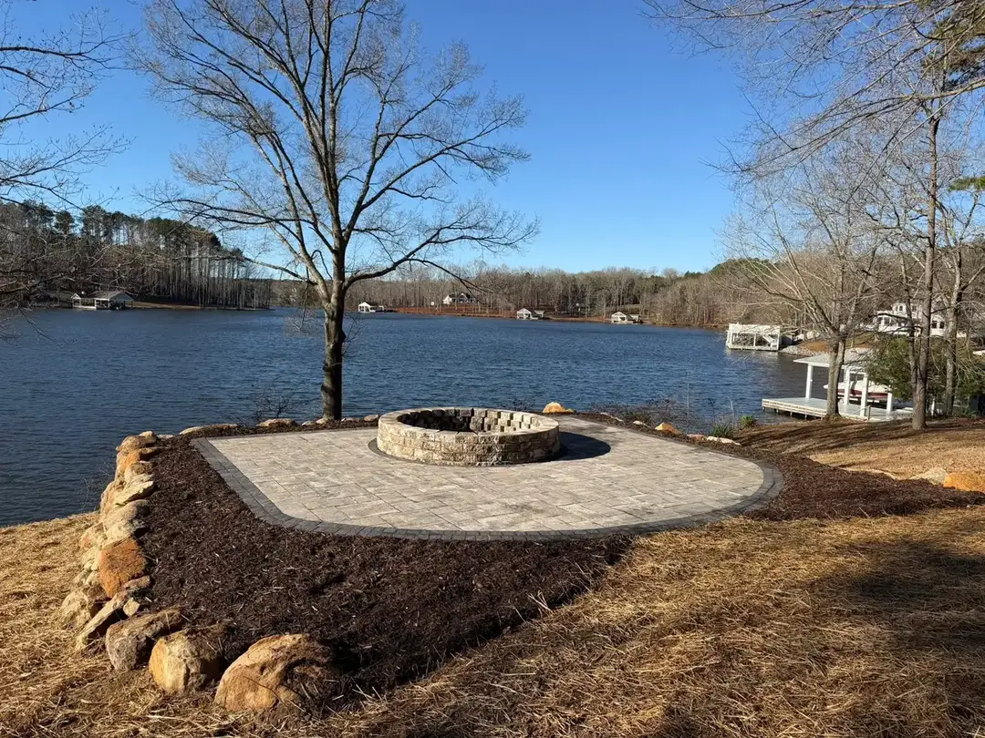 Stone fire pit overlooking the lake